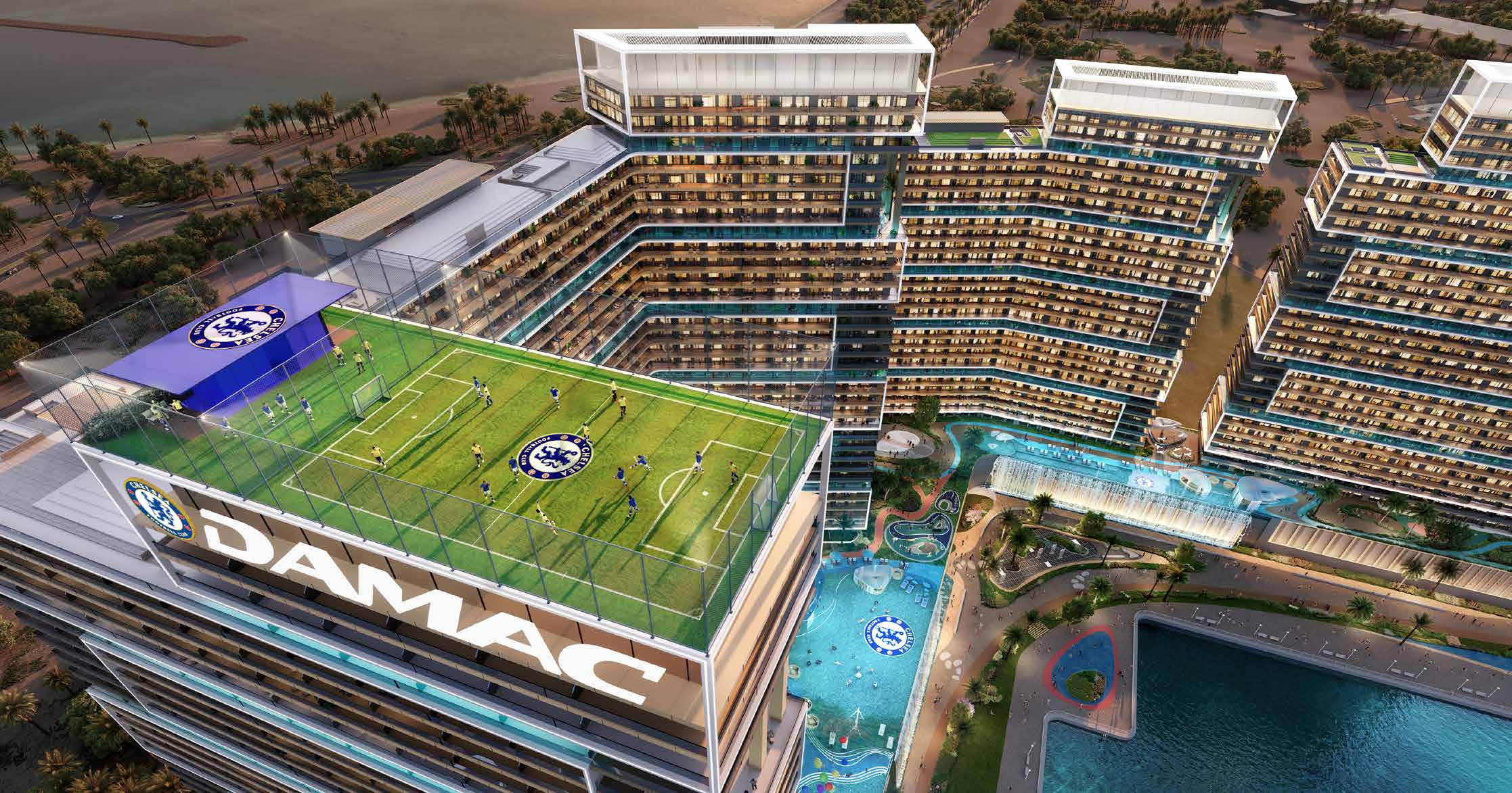 Rooftop football pitch crowning a tower, pools and towers below