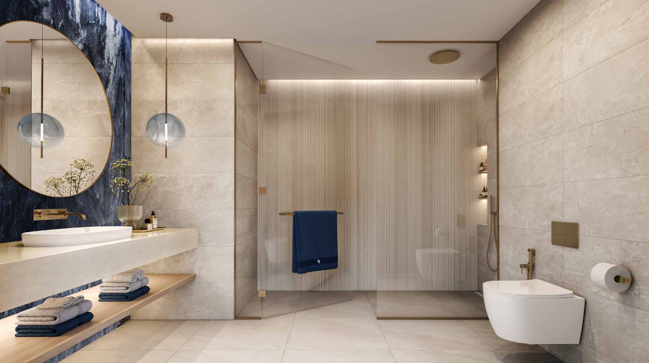 Stone bathroom with round mirror, walk-in shower and blue marble wall